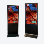 A sleek totem digital signage displaying vibrant content in a busy urban setting.